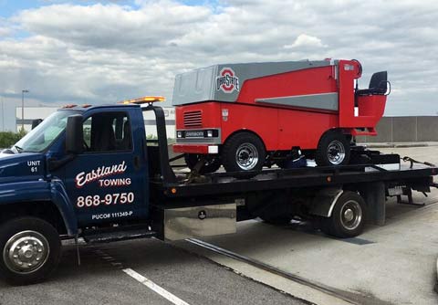 Eastland rollback truck for transporting all wheel drive vehicles, off-road equipment, and HVAC units.